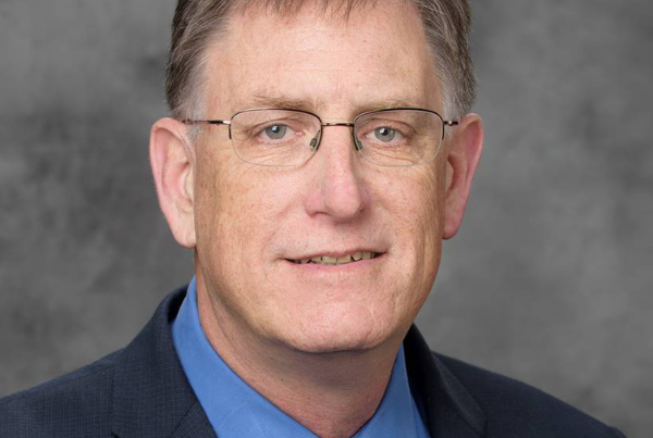 a headshot of dan dumbacher of aiaa